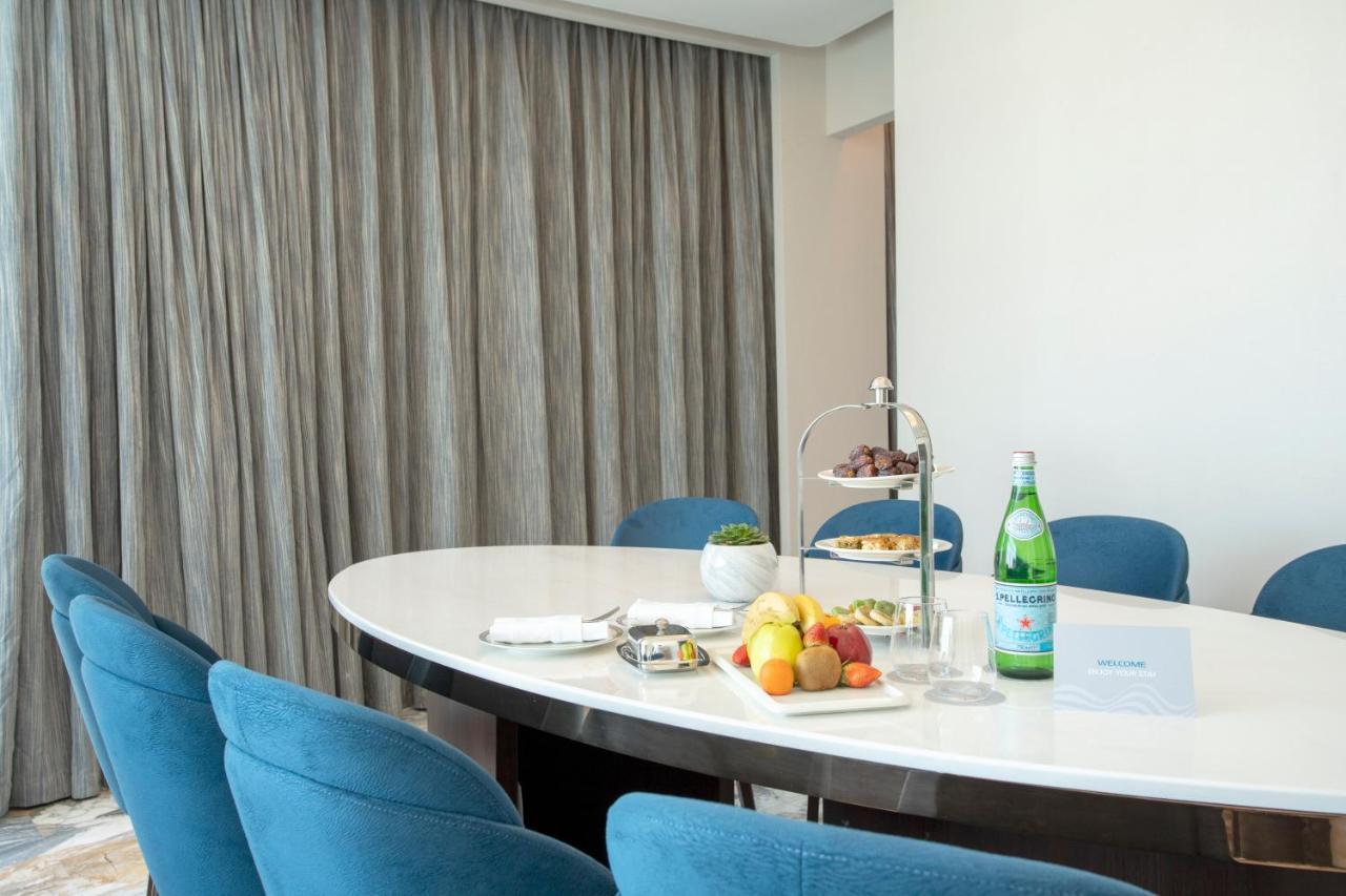 Century Marina Hotel - Lusail Kültér fotó A table with a bottle of mineral water